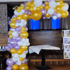 Organic Demi Arch: Latex balloon in Gold, Purples  and White in various sizes. Arch place over a table for cake.