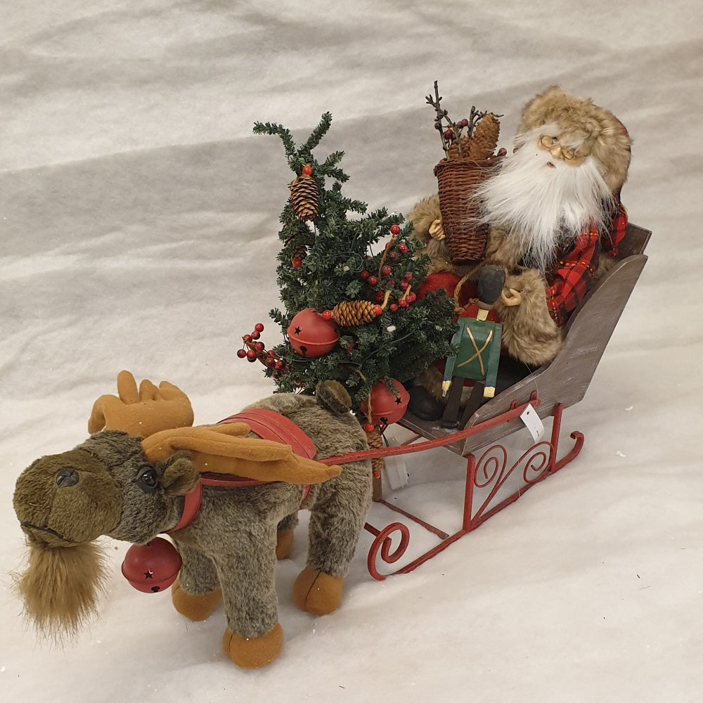 Santa in sleigh with reindeer
