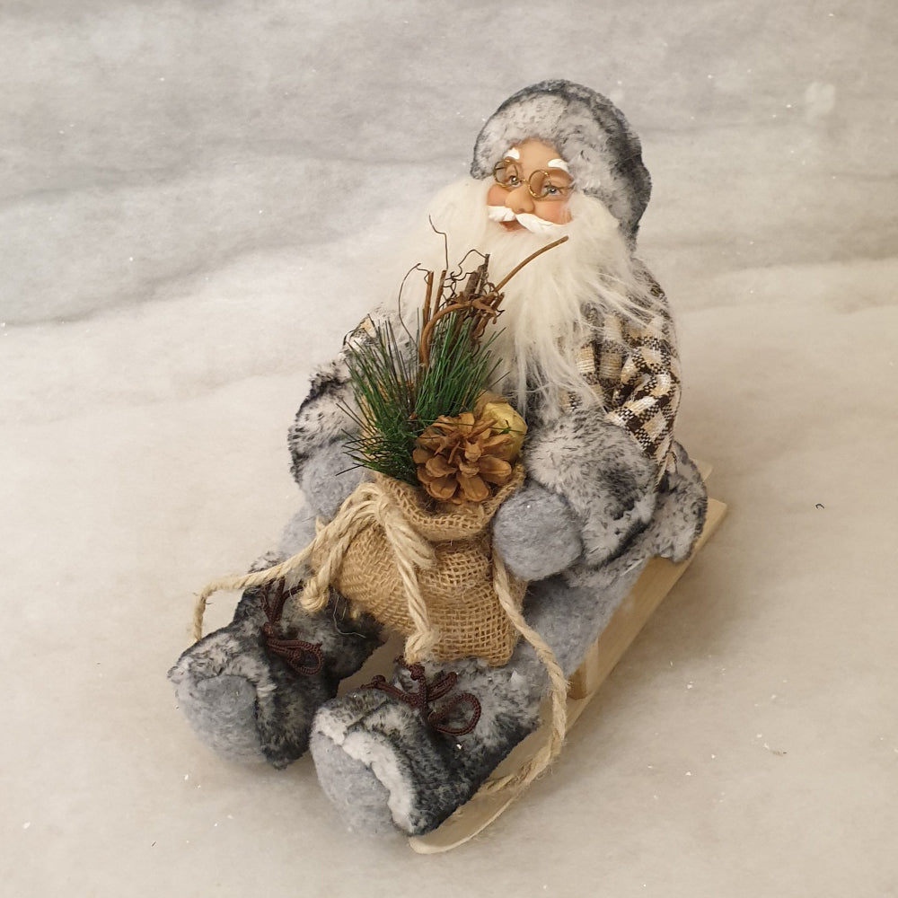 Grey Santa Figurine on sleigh